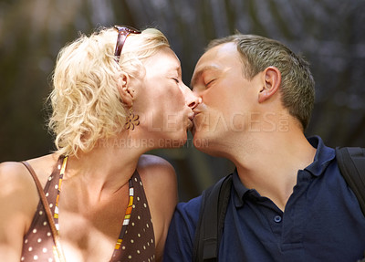 Buy stock photo Romance, couple and kiss together outdoor, care and healthy relationship, connection or bonding. Lips touch, man and woman in love, face profile and support, marriage commitment and passion on date
