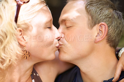 Buy stock photo Love, couple and kiss together outdoor, care and healthy relationship, connection or bonding. Lips touch, man and woman in romance, face profile and support, marriage commitment and embrace on date
