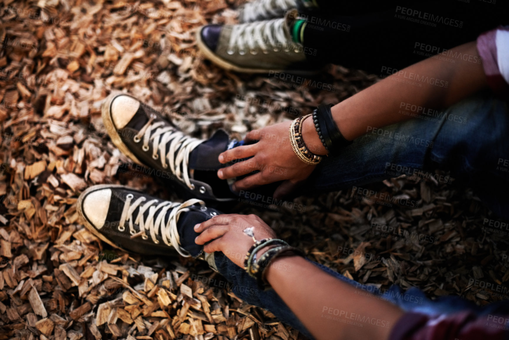 Buy stock photo Sneakers, shoes and people in woods with ground, soil or dirt in nature with friends together. Legs, feet and relax outdoor on holiday, vacation or summer in the forest with man and woman closeup