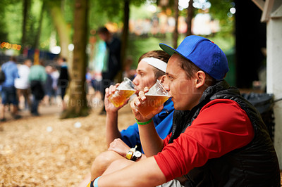 Buy stock photo Beer, nature festival and relax friends drinking for break, wellness beverage or woods social event. Forest music concert, drunk men and outdoor people sitting with alcohol product, cup or liquid