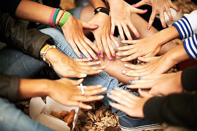 Buy stock photo Hands, manicure and a group of girl friends outdoor at a music festival sitting in a circle from above. Party, event and hipster people on the ground at a concert, show or performance together