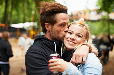 Buy stock photo Happy couple, kiss and outdoor festival for love, care or support at party, DJ event or music. Portrait of man hug woman with smile in embrace, affection or trust for festive or summer celebration