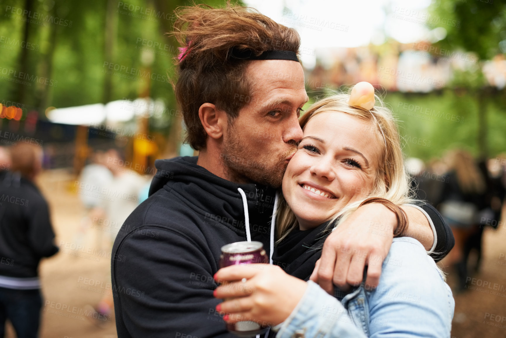 Buy stock photo Happy couple, kiss and outdoor festival for love, care or support at party, DJ event or music. Portrait of man hug woman with smile in embrace, affection or trust for festive or summer celebration