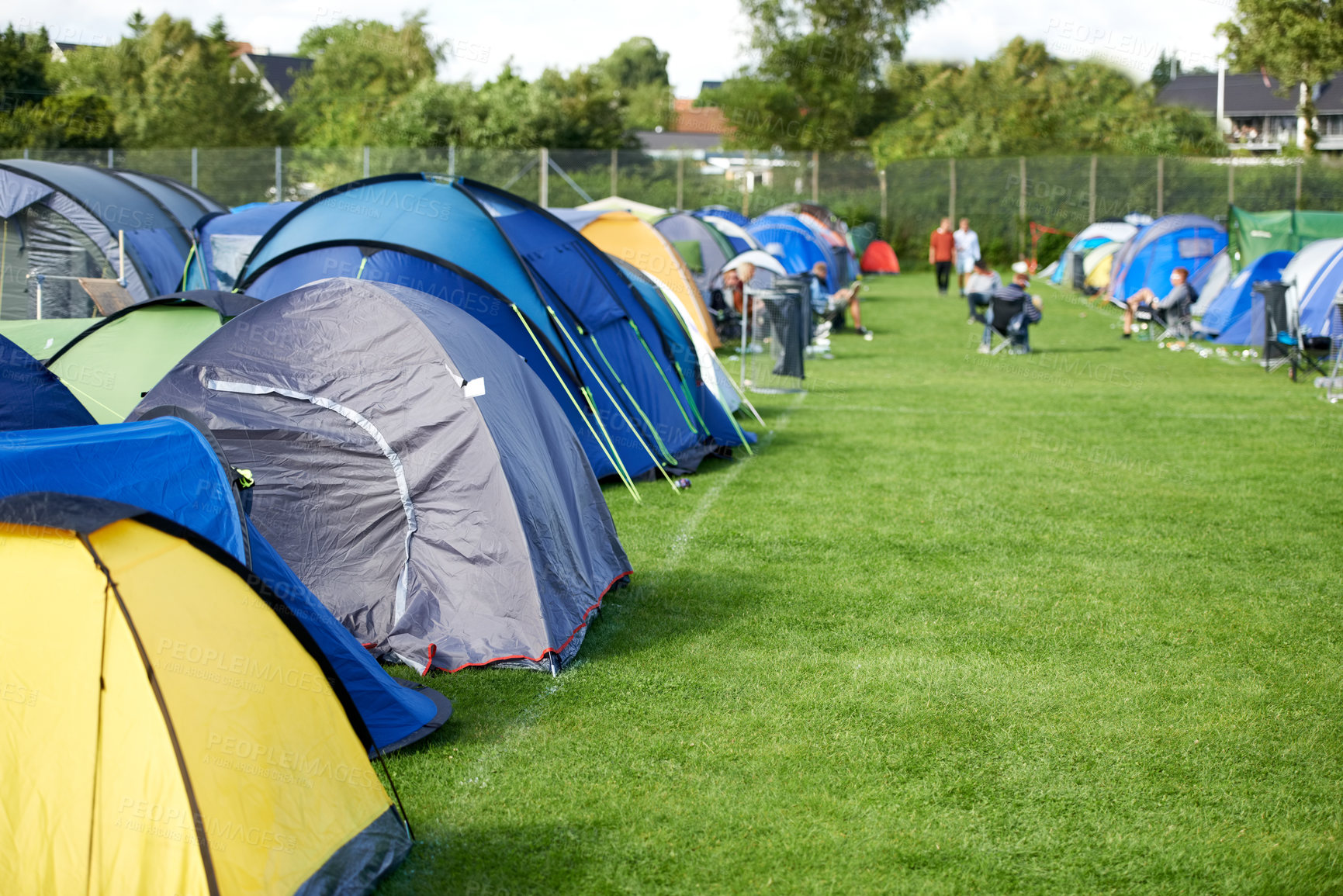 Buy stock photo Camping, tents and outdoor music festival in park with people on field with grass or trees in summer. Camp, site and shelter at party, event or travel in woods for concert, adventure and carnival 