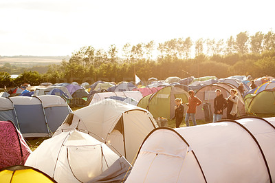 Buy stock photo Shot of a large group of tents on a campsite at a festival