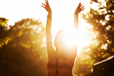 Buy stock photo Woman, sunset and outdoor festival for party, event or holiday weekend with arms up in nature freedom. Excited casual female person in celebration for music, concert or sunrise in forest outside