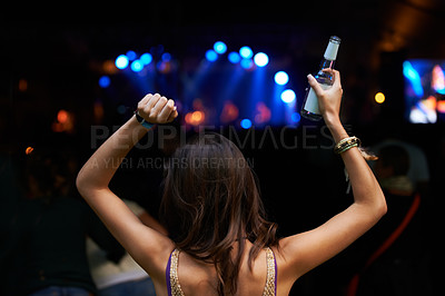 Buy stock photo Woman, back and dancing at night festival, party or music concert for DJ, performance or sound. Rear view of female person enjoying late evening entertainment at outdoor carnival, rave or audio event