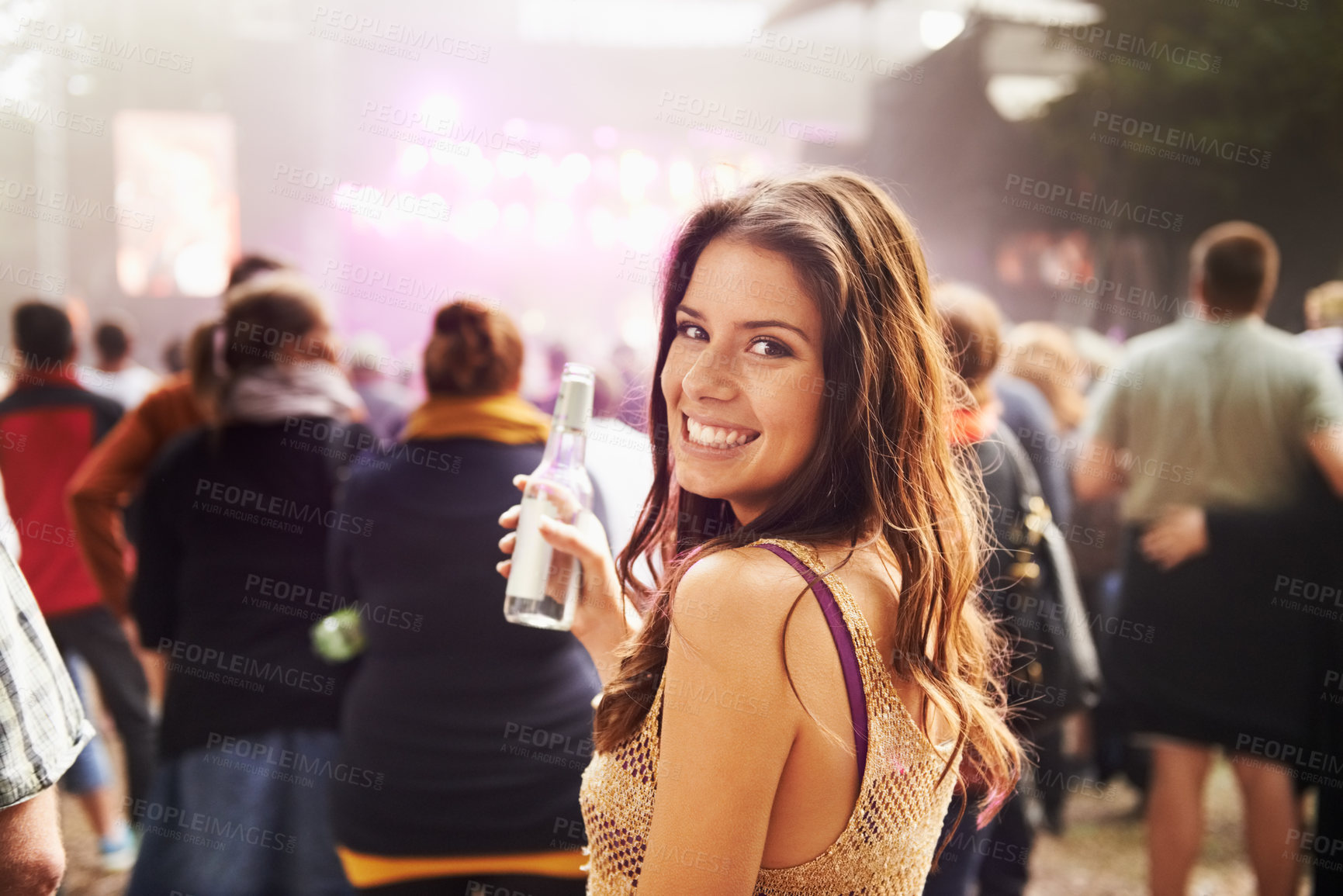 Buy stock photo Happy woman, portrait and drink at outdoor music festival with crowd for party, event or DJ in nature. Face of female person smile enjoying sound or audio at carnival, concert or performance outside