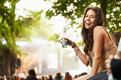 Buy stock photo Happy woman, portrait or laughing with drink at music festival, event or outdoor party in nature. Female person smile with alcohol enjoying sound or DJ performance at concert, carnival or summer fest