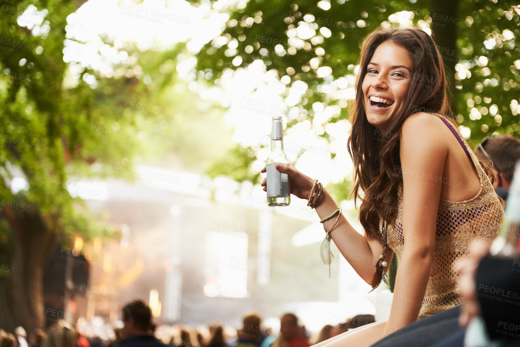 Buy stock photo Happy woman, portrait or laughing with drink at music festival, event or outdoor party in nature. Female person smile with alcohol enjoying sound or DJ performance at concert, carnival or summer fest