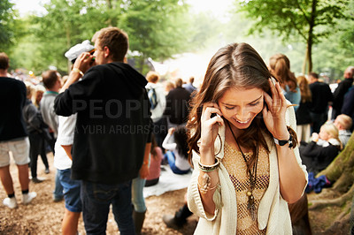 Buy stock photo Music festival, event and woman outdoor with phone call, conversation and noise from crowd at a party. Contact, person and confused by loud, sound or listening to smartphone for communication at rave
