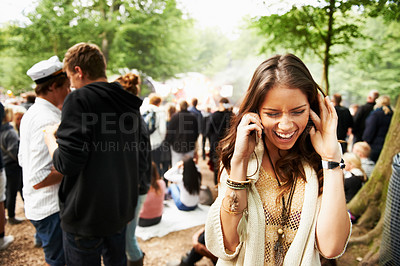 Buy stock photo Woman, phone call and loud music festival for communication, conversation or networking in nature. Female person struggling to hear on mobile smartphone for discussion at outdoor concert or event