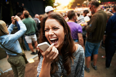 Buy stock photo Music festival, concert and woman outdoor with phone call, shouting or energy at rave party with crowd at event. Contact, person and loud voice, sound or screaming conversation at smartphone to hear