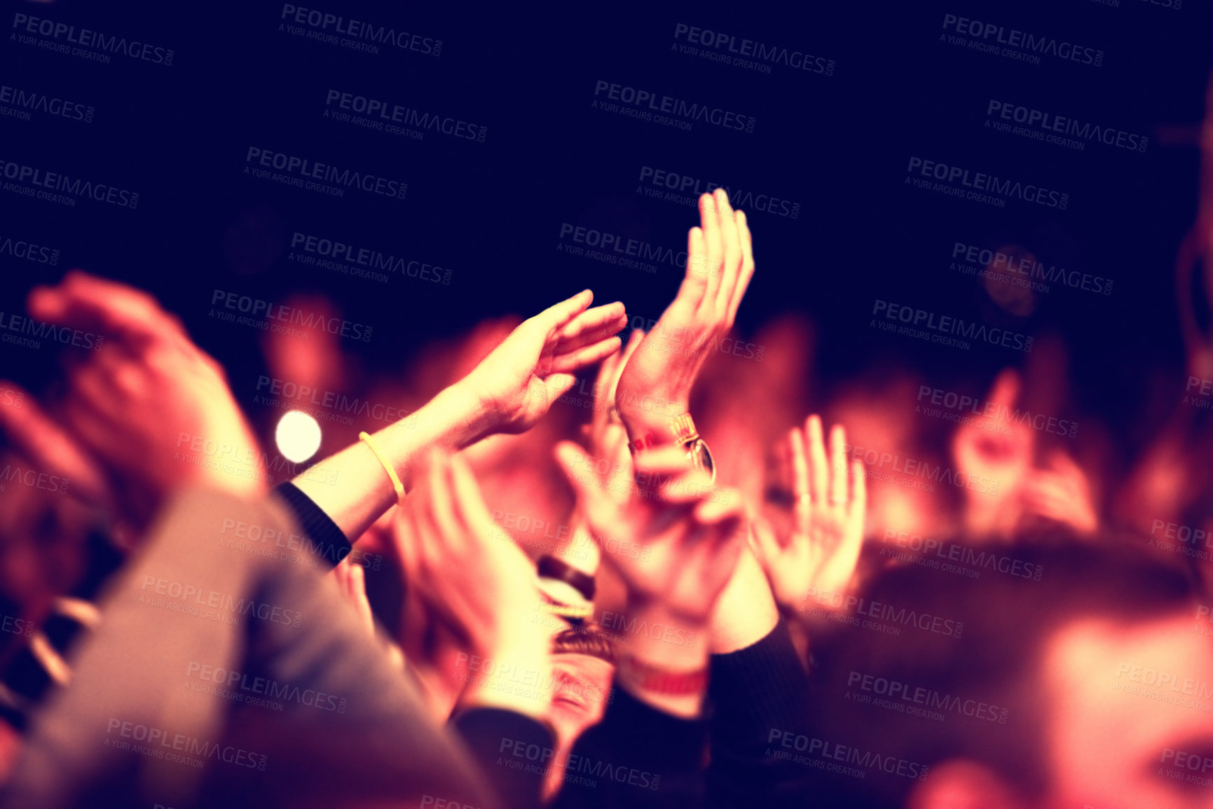 Buy stock photo An audience with hands  raised at an outdoors festival