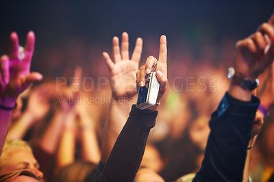 Buy stock photo Hands, camera and a crowd of people at a music festival closeup with energy for freedom or celebration. Party, concert or event with an audience at a rock or musical performance or nightlife show
