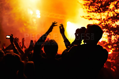 Buy stock photo People, silhouette and camera with crowd at festival, music or concert for pictures, social media or news article. Dark, photographer or person with bright, orange and lighting for rock performance