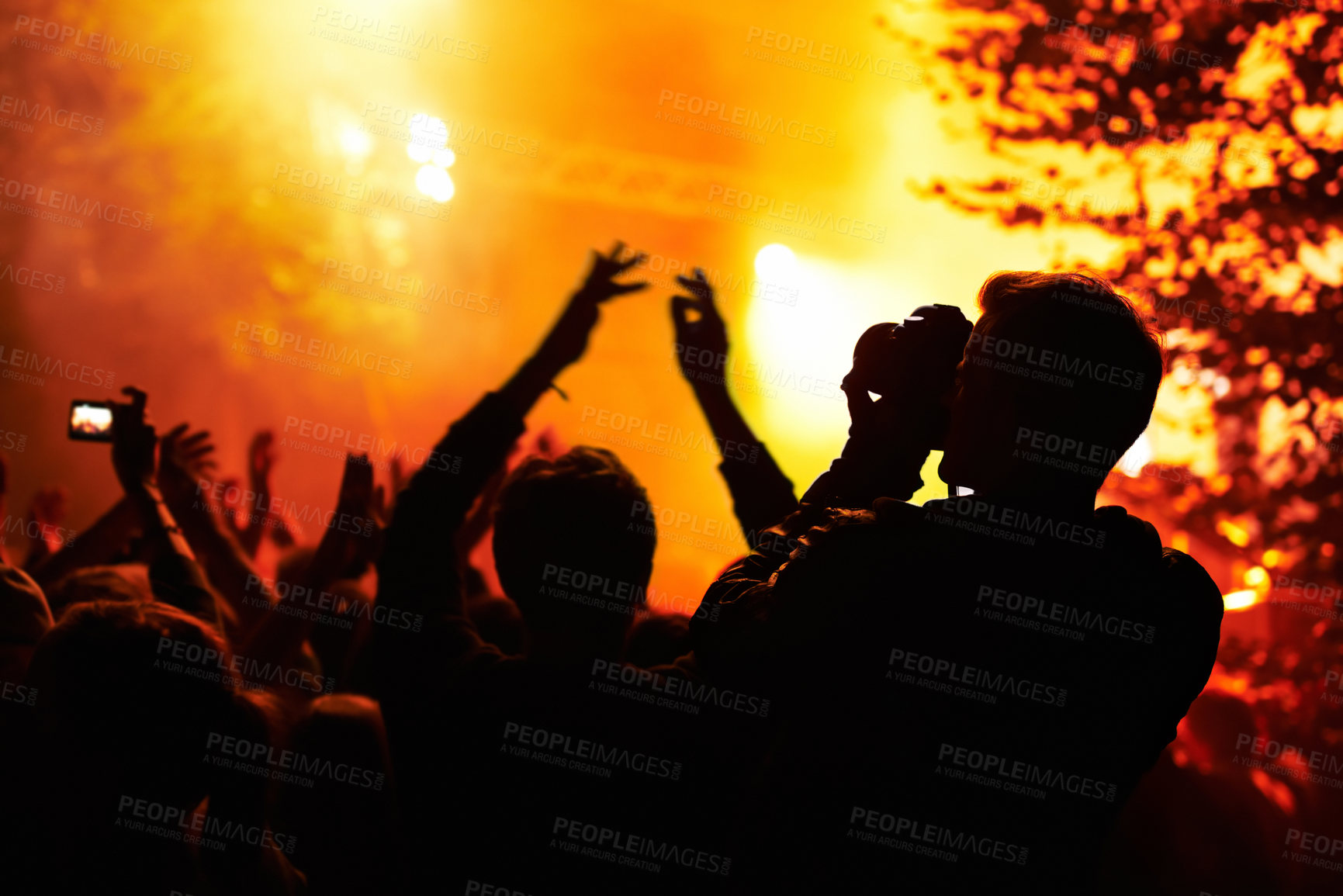 Buy stock photo People, silhouette and camera with crowd at festival, music or concert for pictures, social media or news article. Dark, photographer or person with bright, orange and lighting for rock performance