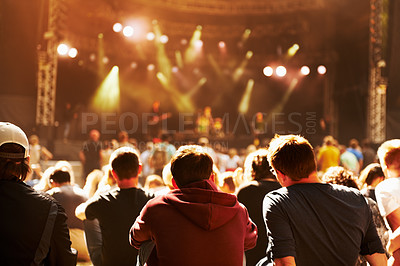 Buy stock photo Rear view of an audience watching a performance at a music festival