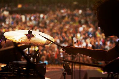 Buy stock photo Drummer, music and crowd at stage, concert or musician in performance at festival or event with fans. Playing, rock or man on drums in a metal band with audience listening to beat, sound or show