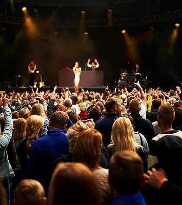 Buy stock photo Dance, music and stage with crowd at festival for concert, dj show and rave performance. Rock, energy and hands of people dancing in audience for party celebration, disco and techno event