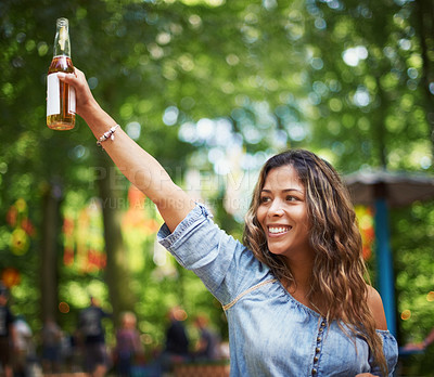 Buy stock photo Happy woman at music festival with dance, beer and relax in woods for concert event. Alcohol, celebration and excited girl at outdoor party in freedom, adventure and person in park, forest and smile.