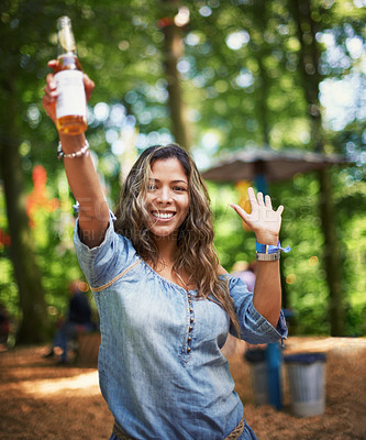 Buy stock photo Portrait of woman at music festival with dance, beer and smile in woods at concert event. Alcohol, celebration and girl at outdoor party in freedom, adventure and person in park, forest and happiness
