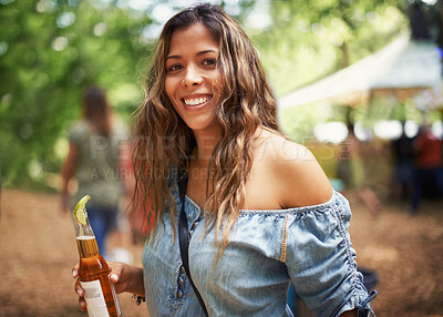 Buy stock photo Portrait of woman at music festival with smile, beer and relax in nature for concert event. Drink, celebration and girl at outdoor party for freedom, adventure and happy people in park, forest or sun