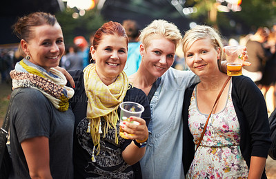 Buy stock photo Portrait of group of women at music festival with beer, smile and hug in nature together. Drink, celebration and friends relax at outdoor party with freedom, adventure and happy people at concert.