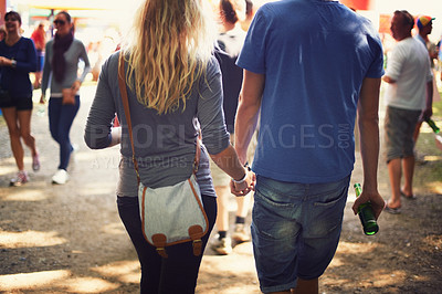Buy stock photo Back, music festival and holding hands with couple, outdoor and walking with summer, vacation and event. Party, outside and man with woman, marriage and party with concert, love and people with joy
