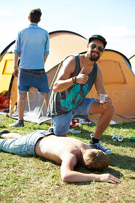 Buy stock photo Sleeping, drunk or friends on grass in festival hangover in a social celebration or party or concert. Portrait, thumbs up or happy people drinking alcohol on outdoor music event or holiday vacation
