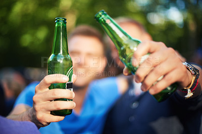 Buy stock photo Men at music festival with cheers, hands with beer and excited in nature together. Drink on bottle, celebration and friends at outdoor party with freedom, adventure and people in on summer vacation.