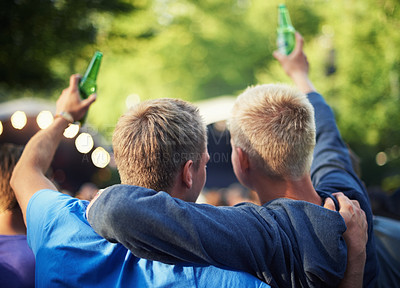 Buy stock photo Back, toast and friends drinking beer at a music festival outdoor for a party, event or celebration. Summer, freedom and community with people enjoying alcohol at a concert, show or performance