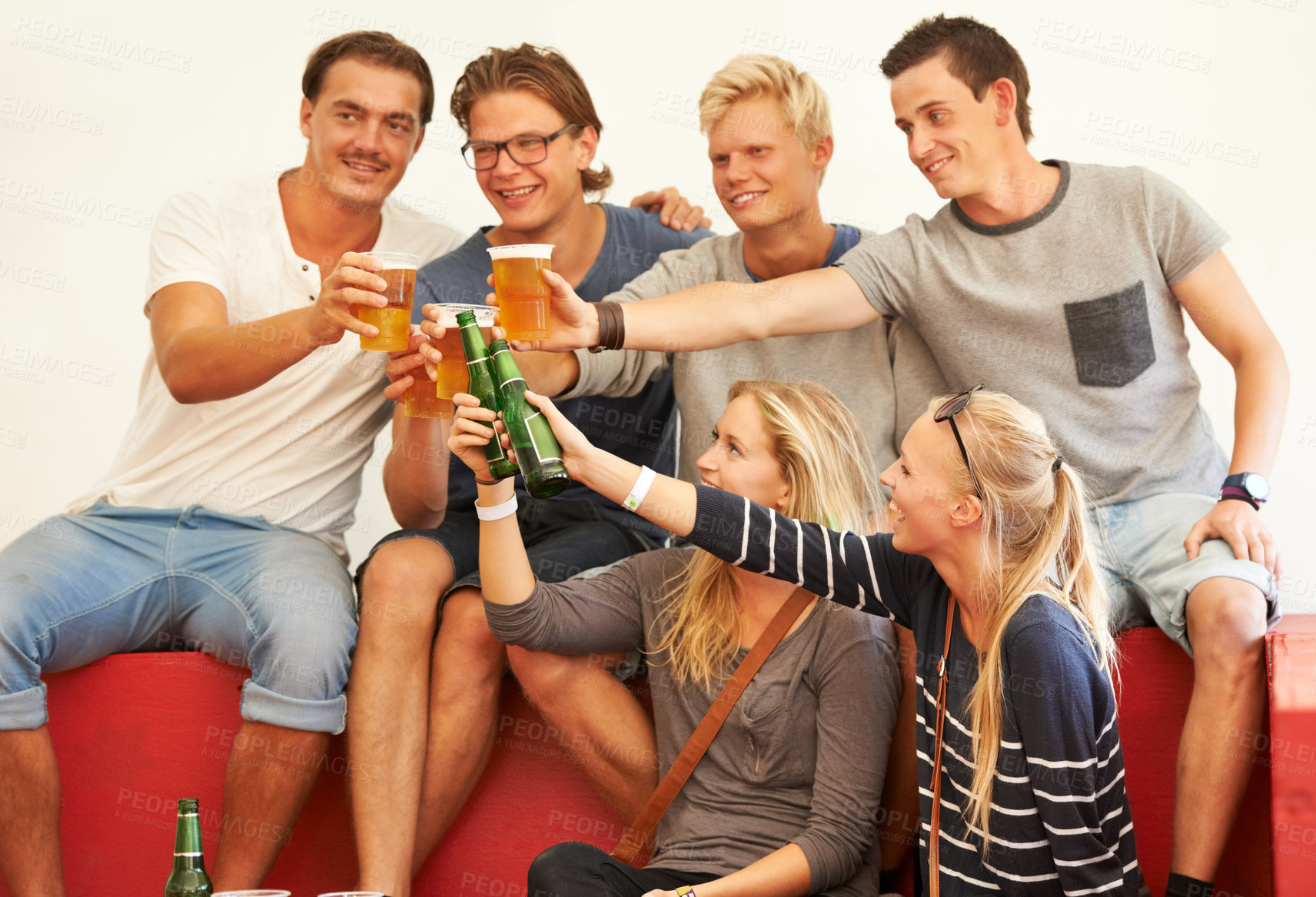 Buy stock photo Drinks, cheers and group at party with beer, alcohol or drunk celebration at social, music festival or event. Friends, relax and drinking outdoor with happiness, freedom and together at a pub