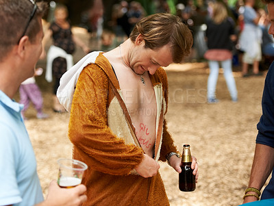 Buy stock photo Animal, costume and man with beer at festival in field with friends and drunk in summer on holiday. Person, drink and relax on vacation at concert or carnival with funny monkey suit and freedom