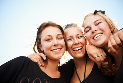 Buy stock photo Friends, portrait and women hug outdoor for travel, bond and having fun on vacation, break or trip. Face, smile and group or people embrace outside for reunion, weekend or holiday hangout on blue sky