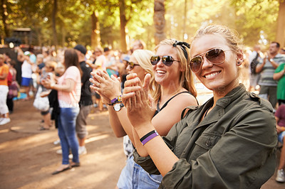 Buy stock photo Woman, friends and outdoor crowd at music festival for summer holiday, celebration or party concert. Female person, clapping and community dancing in nature excited group, event or social gathering