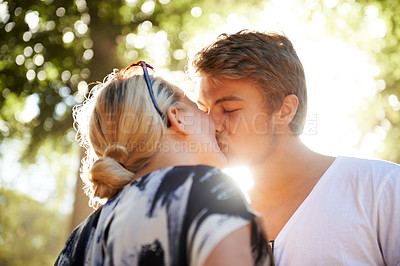 Buy stock photo Couple, kiss and love in outdoors, commitment and loyalty for marriage in nature or forest. Man, woman and bonding or together outside, connection and affection on romantic date at park on vacation