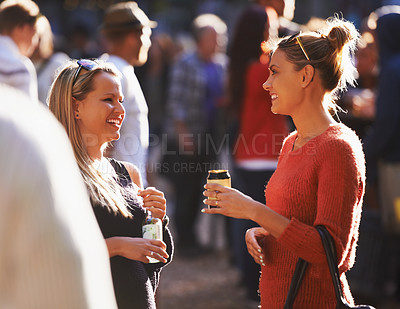 Buy stock photo Music festival, friends and women with alcohol talking outdoors for social party, celebration and camp event. Happy, excited and people with beverage at musical concert for freedom, vacation and fun