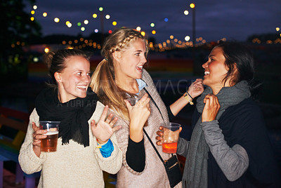 Buy stock photo Friends, beer outdoor at night or music festival in forest adventure, nature celebration or group connection. Woman, face and smile for alcohol drinking or cheers toast for summer, travel or vacation