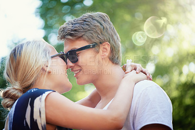 Buy stock photo Happy couple, holiday or hug for love in park, nature or outdoors on a romantic date for support. Wellness, relationship or man with woman, smile or trust for kiss, care or freedom together outside