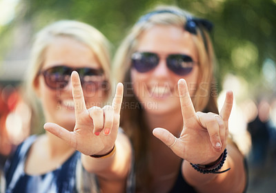 Buy stock photo Rock, hands or portrait of friends in music festival on holiday vacation together to relax with smile. Party, reunion celebration or excited gen z women with devil horns for a fun memory or event
