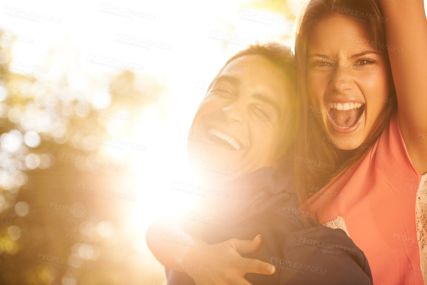 Buy stock photo Love, energy and portrait of happy couple in a park with piggyback, fun or bonding together. Freedom, face and excited people in a forest for back ride, support and adventure in the woods at sunset