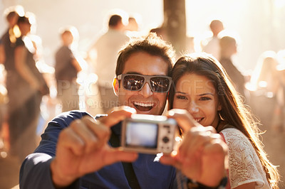 Buy stock photo Happy couple, camera and selfie at music festival for memory, photography or picture in outdoor crowd. Excited man and woman smile for photograph, photo or capture at party, carnival or summer fest