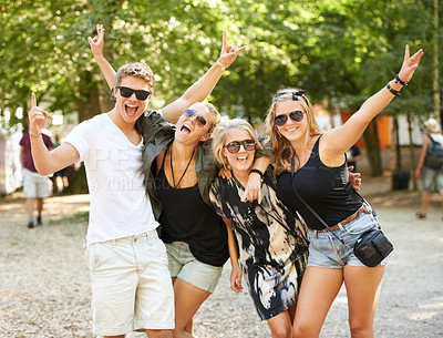 Buy stock photo Four friends partying and celebrating at a music festival