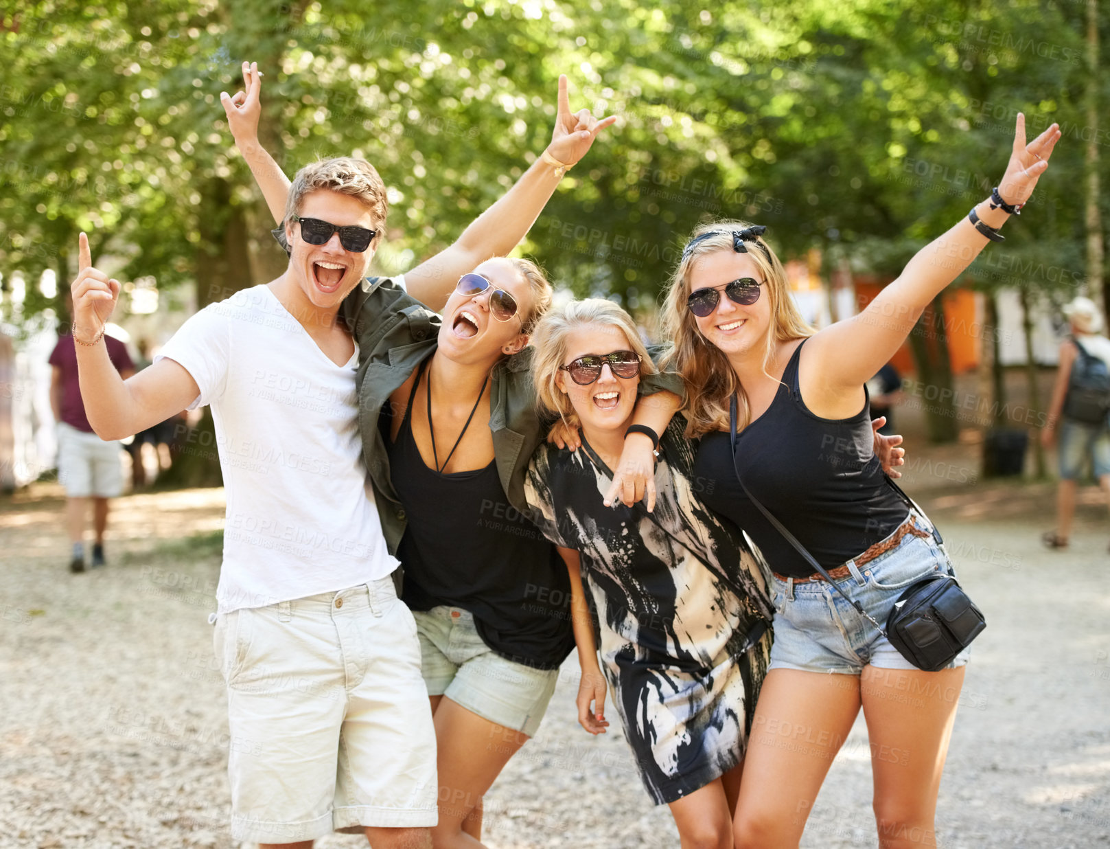 Buy stock photo Four friends partying and celebrating at a music festival