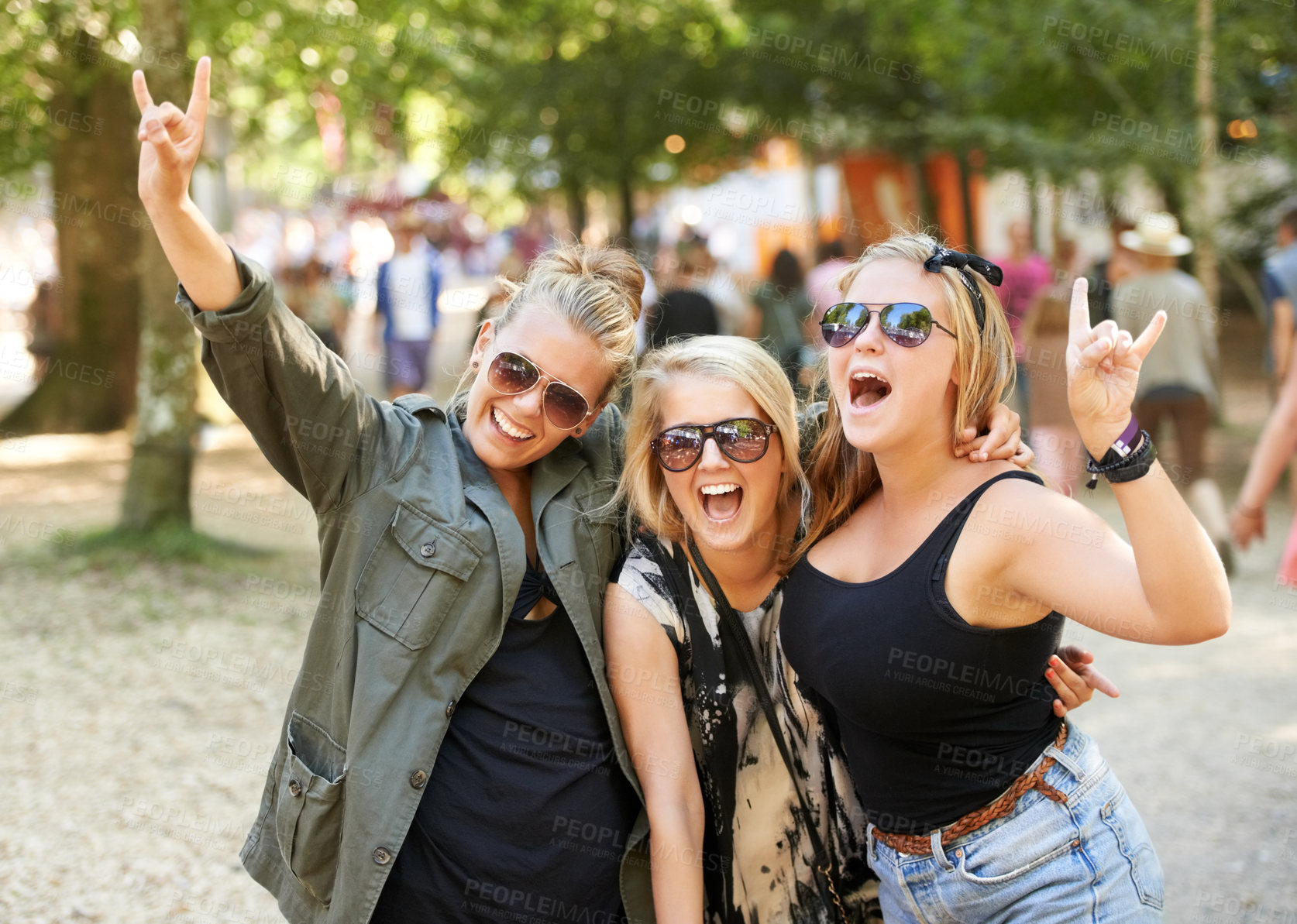 Buy stock photo Three girlfriend's partying at an outdoors music festival