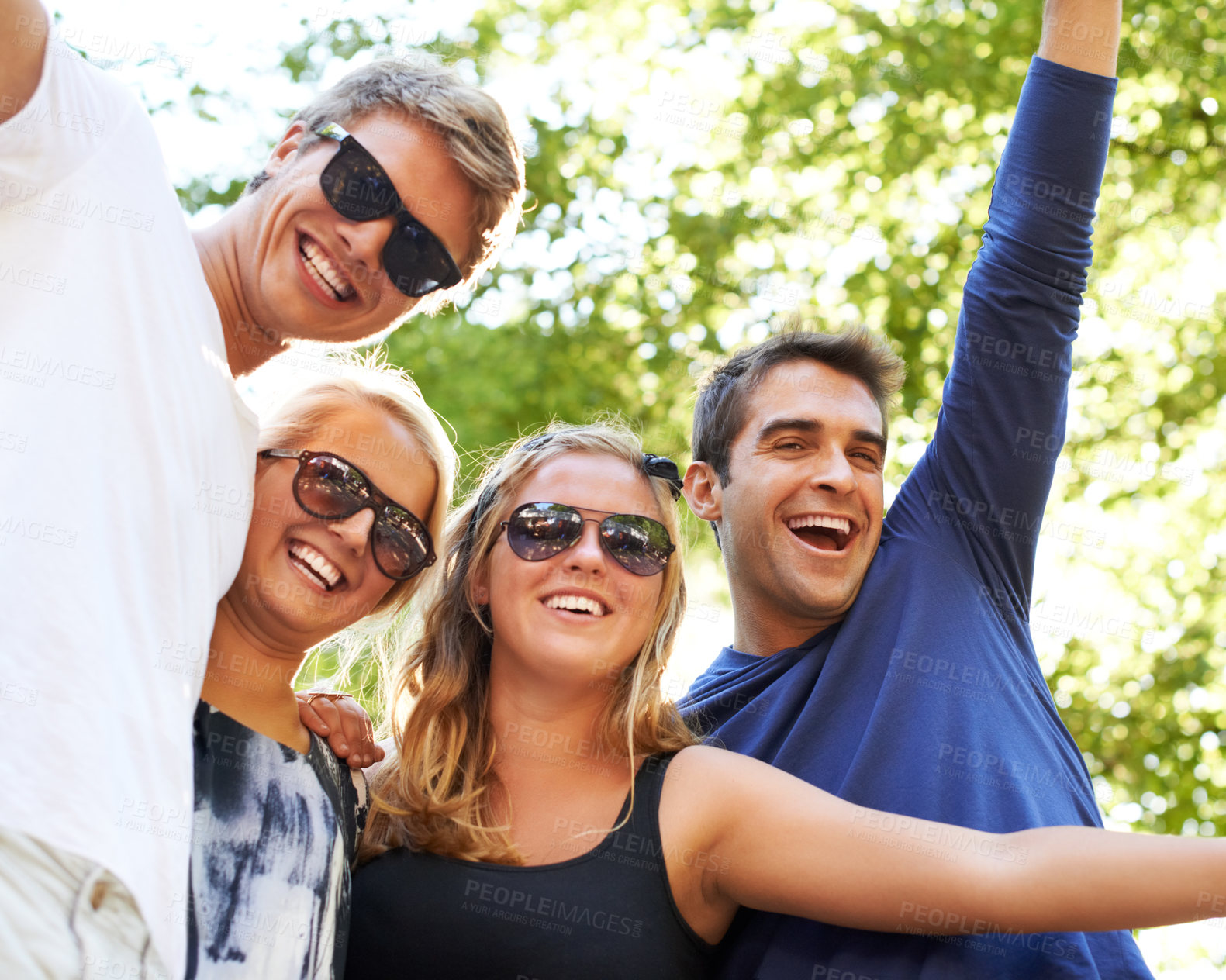 Buy stock photo Face, celebration and friends at a park for music festival, concert or happy reunion. Hug, fun and crowd people in a forest with freedom, energy and excited for event, gathering or party in nature