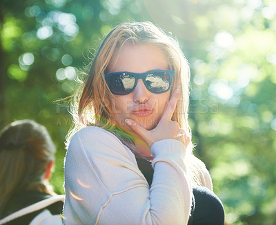 Buy stock photo Young woman posing with a pout while outdoors