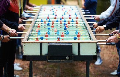 Buy stock photo Cropped view of people playing a foosball table