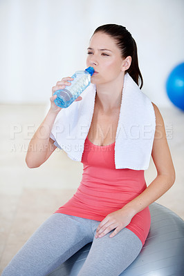 Buy stock photo Ball, portrait or woman drinking water on break after exercise, workout or fitness training in gym. Fatigue, tired lady or thirsty sports athlete with liquid bottle for wellness, rest or hydration